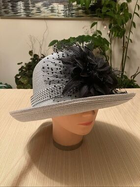 Elegant Metallic Silver Hat with Black Floral Accent And Silver Beaded Band